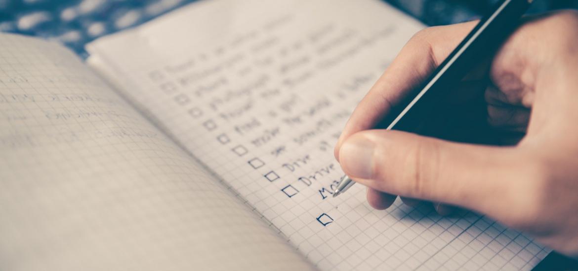 paper journal with a checklist