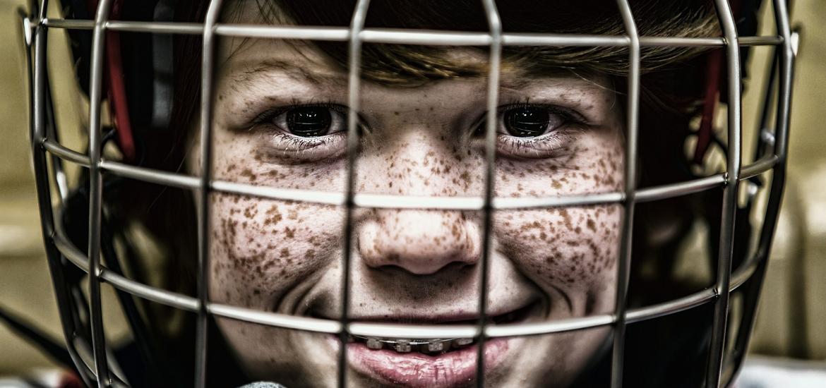Kid in a helmet with grid mask