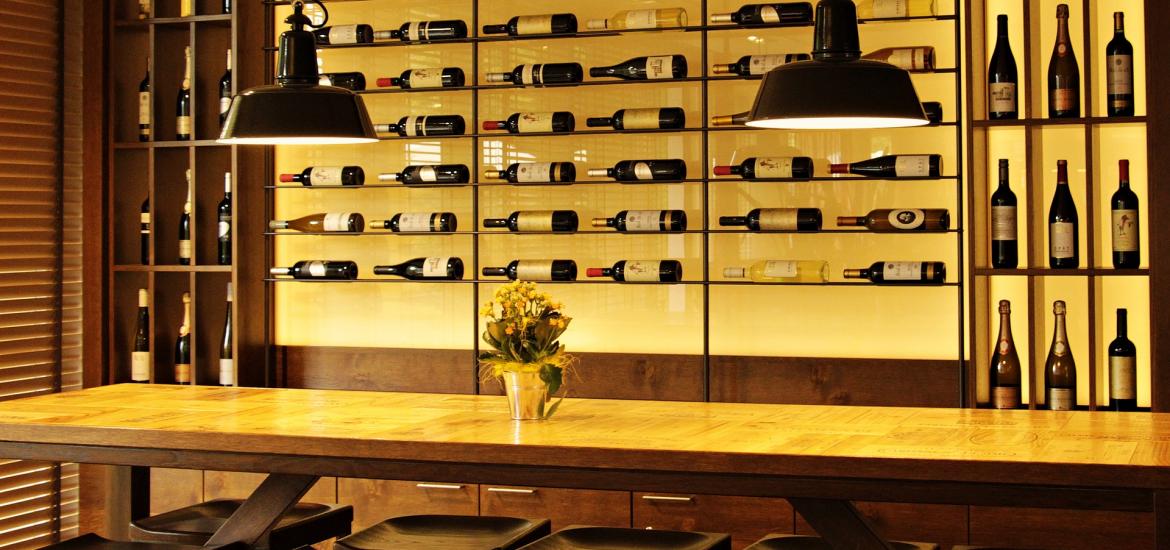 Collection of wine bottles displayed on a wall